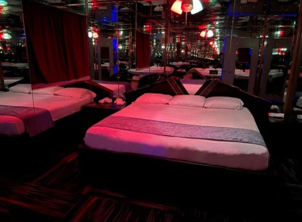 Mirrored playroom with bed and red lighting