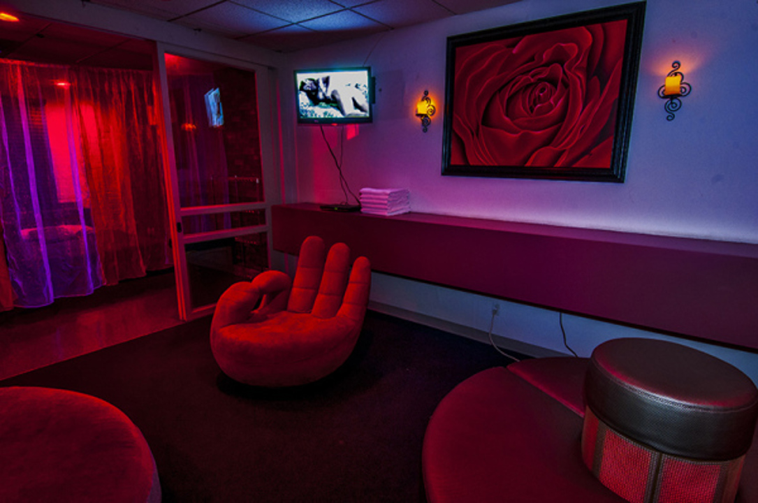 Nightclub interior with illuminated dance floor and colorful light panels