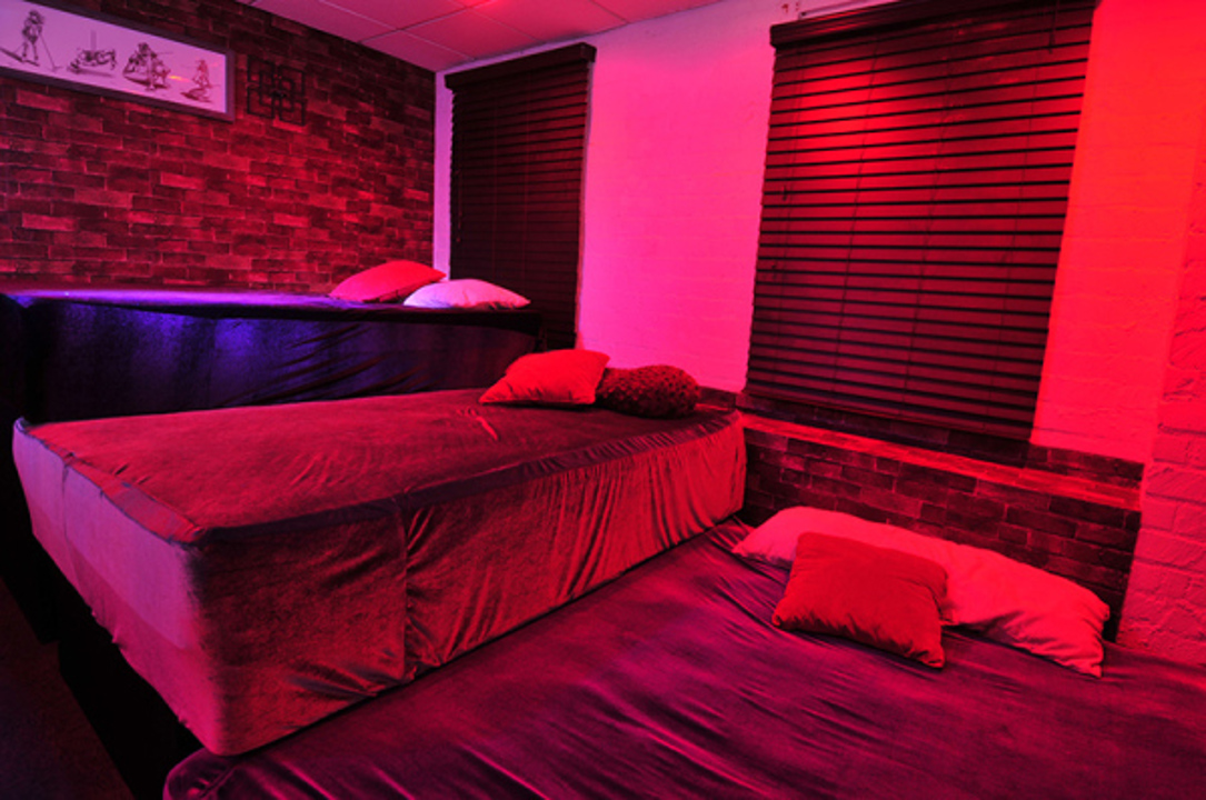Lounge with leather seating and colorful ambient lighting