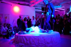 Immersive rope performance under pink and blue lighting at KNKY Rabbit Club in Los Angeles, California