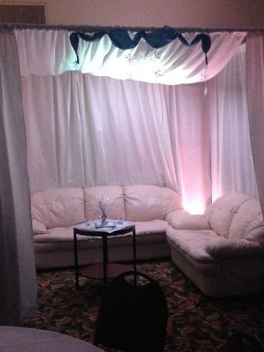VIP cabana lounge with sofas and ambient lighting