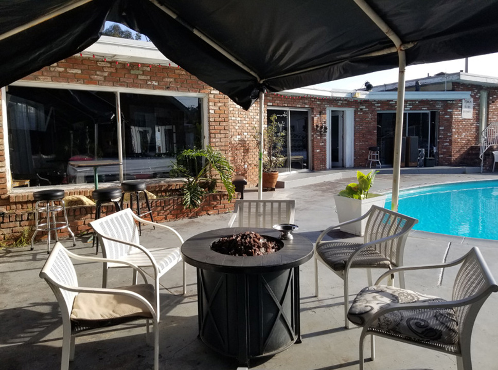 Poolside patio with fire pit seating