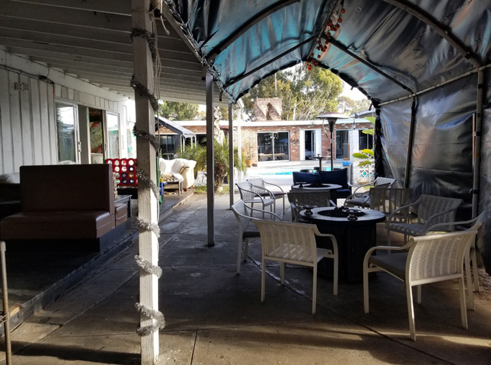 Covered outdoor patio and pool area