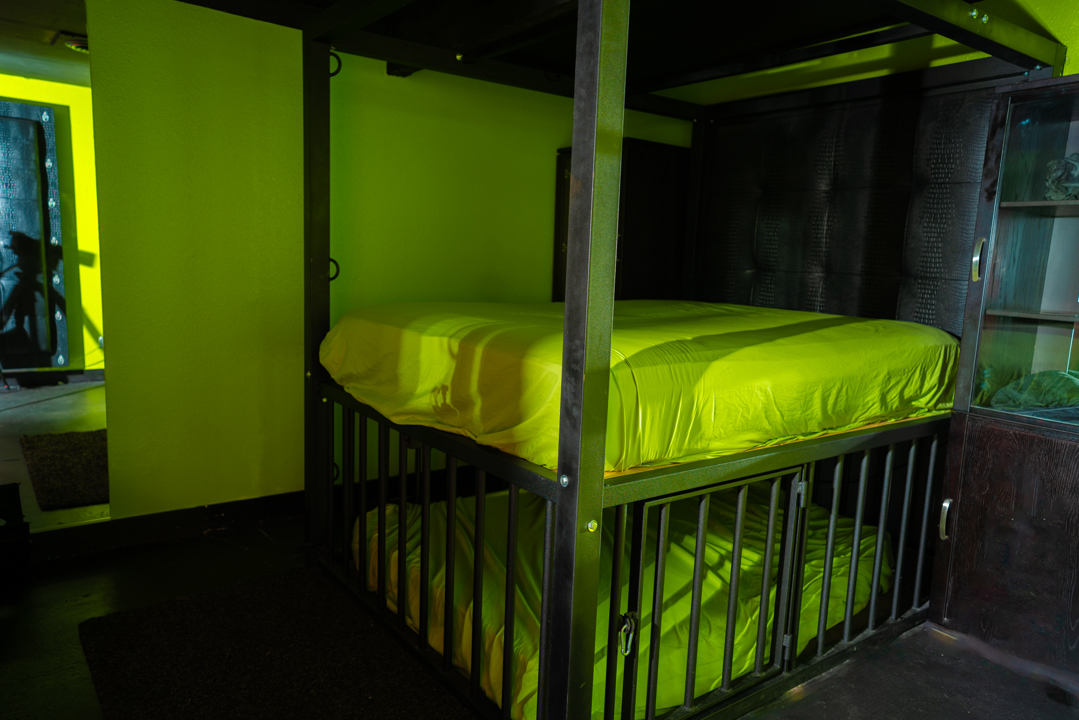 Private room with metal-framed bed