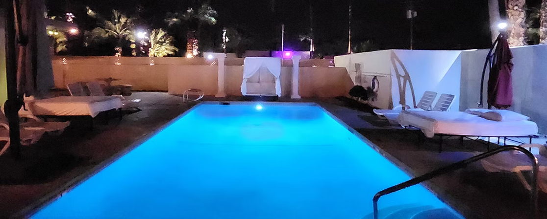 Second outdoor pool illuminated at night