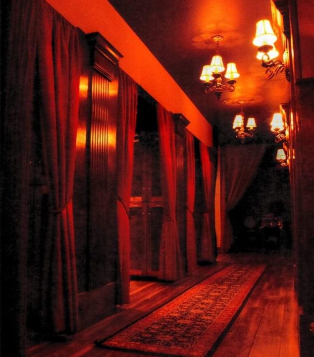 Hallway with red lighting and curtains