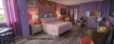Jeannie In A Bottle Suite with pink and purple decor at Rooftop Resort in Hollywood, Florida
