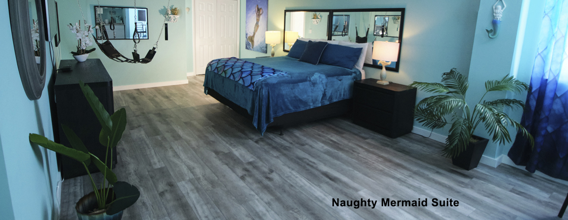 Naughty Mermaid Suite with blue bedding and turquoise decor