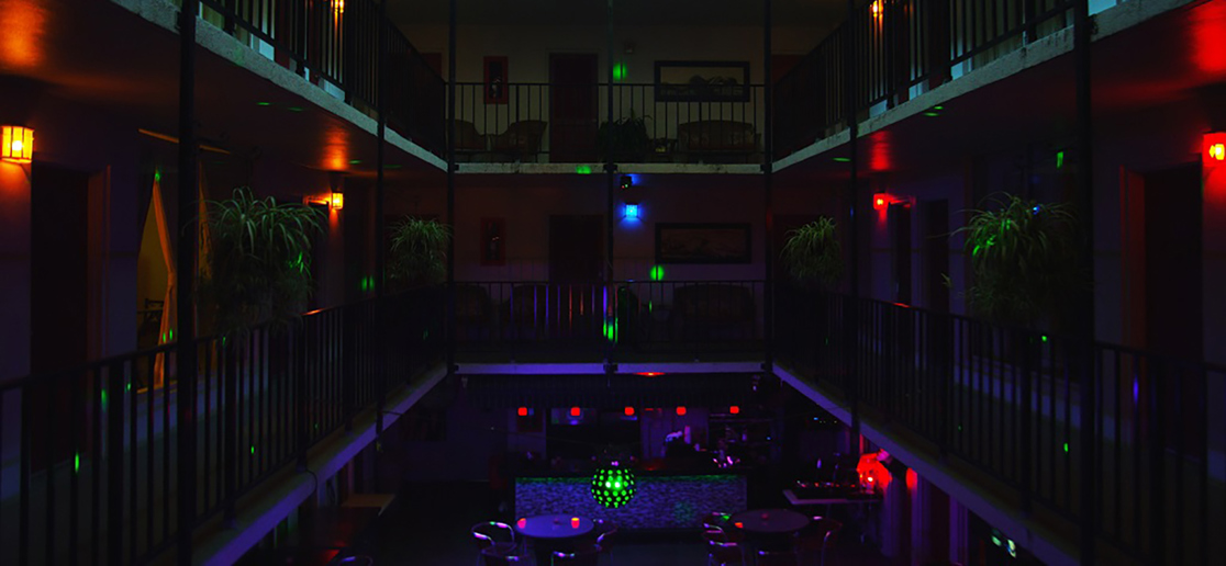 Nightlife lounge with colorful lighting and dance area