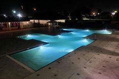Secrets Hideaway Resort and Spa illuminated pool at night in Kissimmee, Florida