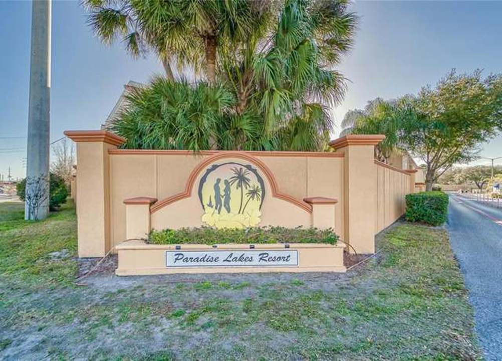 Entrance surrounded by tropical landscaping