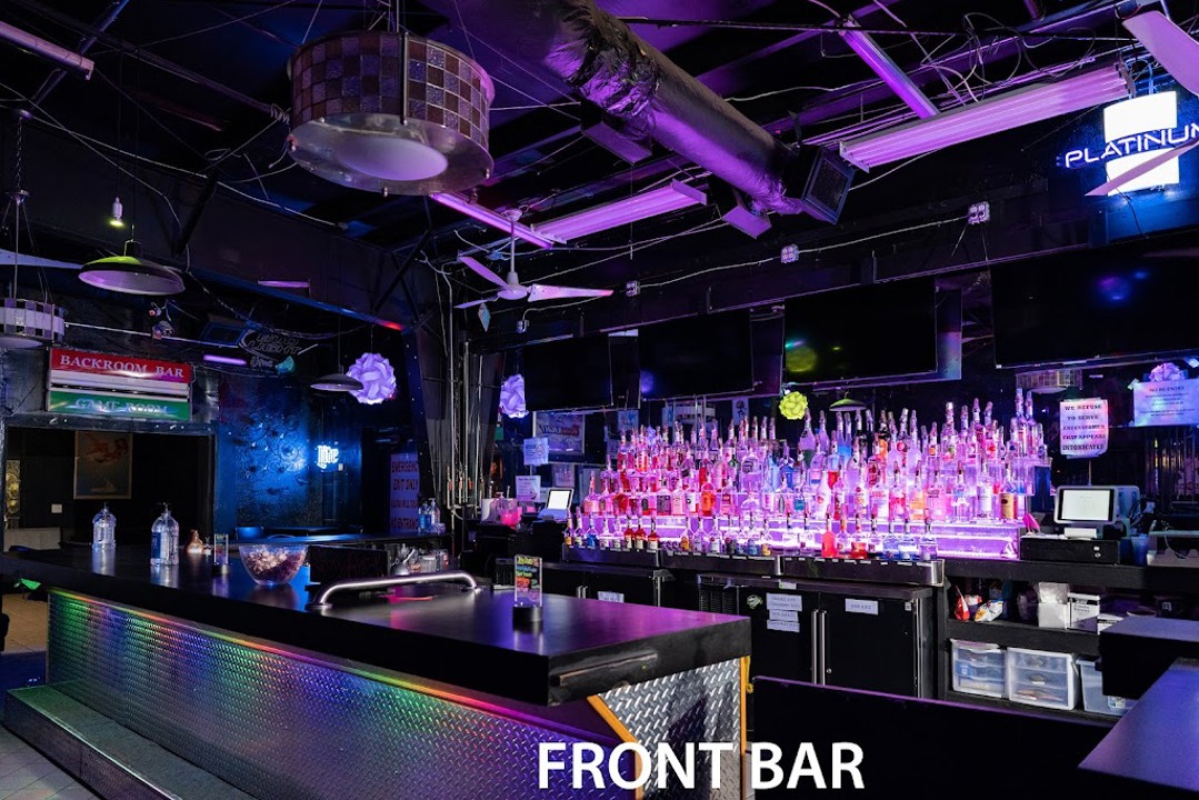 Front bar interior with illuminated liquor bottles