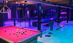 Kraken Ranch club interior with pool table and lounge seating in Punta Gorda, Florida