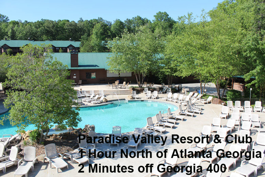 Large swimming pool surrounded by lounge chairs