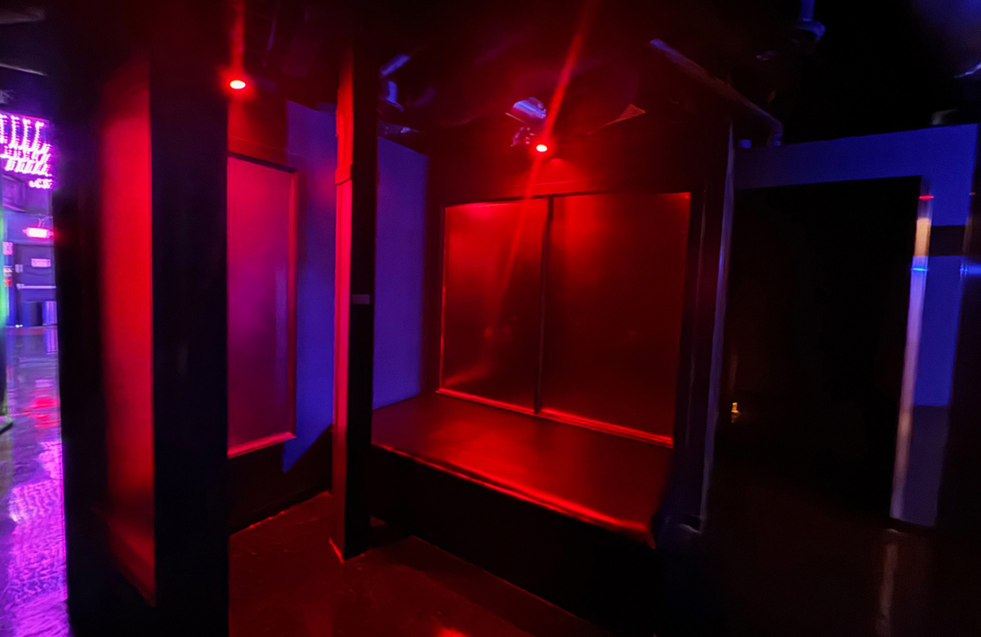 Red-lit semi-private relaxation room
