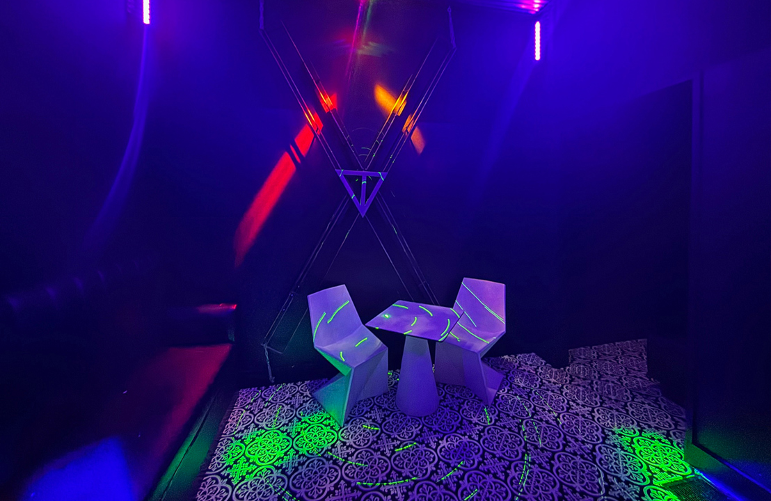 UV-lit lounge with table and chairs