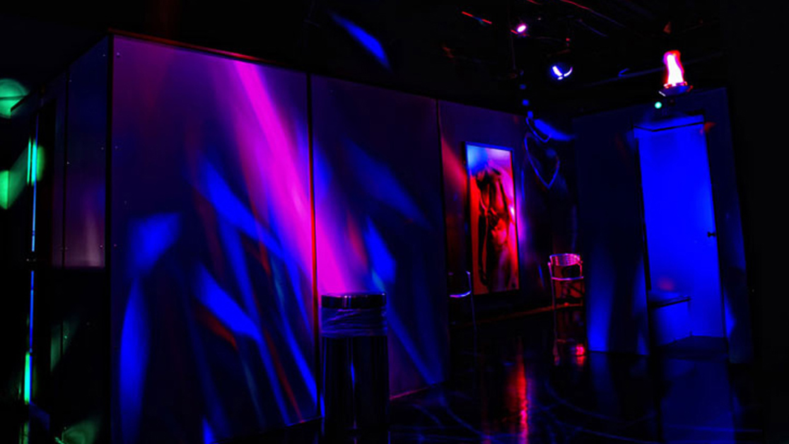 Colorfully lit interior hallway