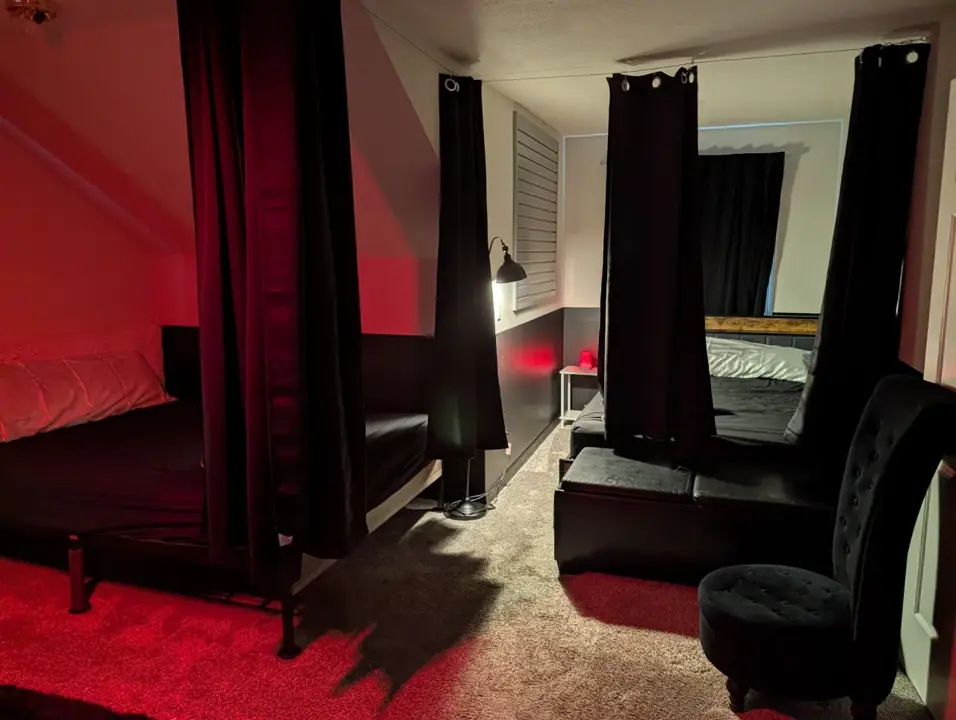Private play room with curtained beds and seating