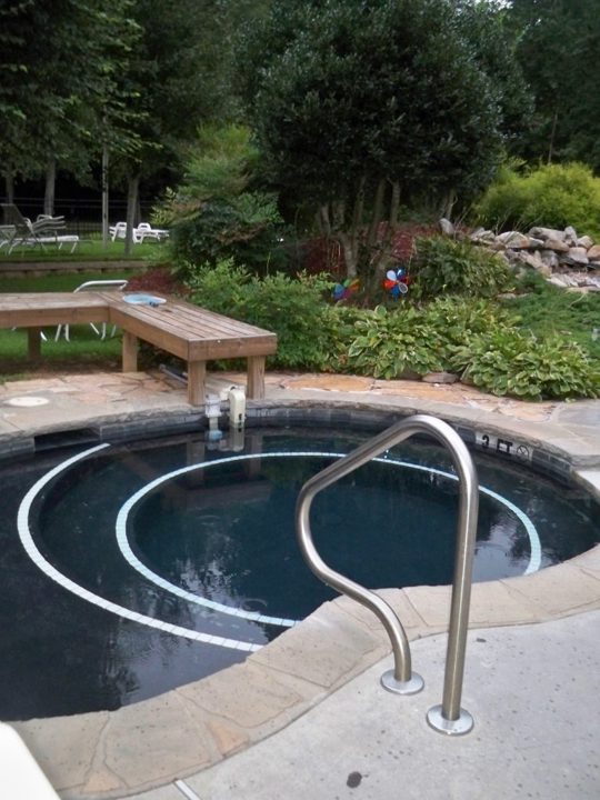 Landscaped outdoor hot tub