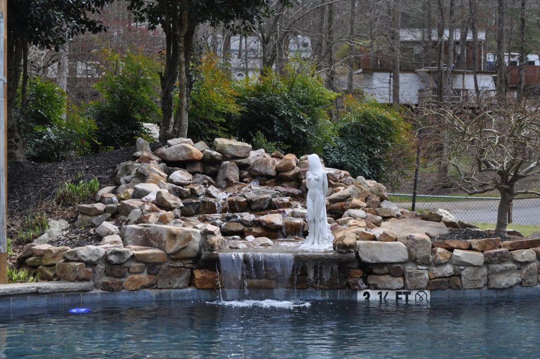 Rock waterfall beside the swimming pool