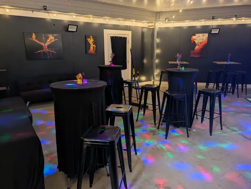 Cocktail lounge with tables and party lighting