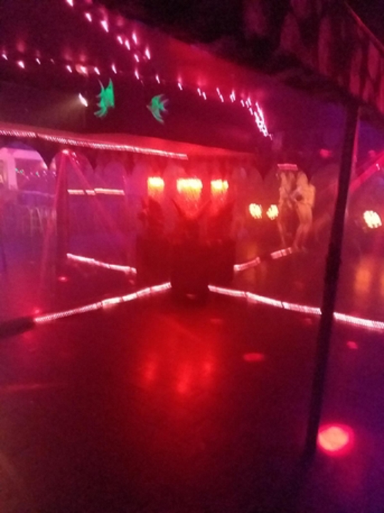 Red-lit mirrored dance floor