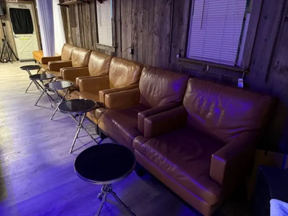 Seating area with leather chairs and tables
