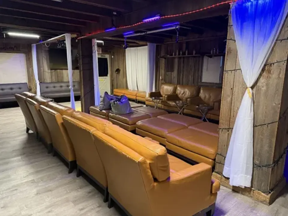 Social lounge with sofas and curtained areas