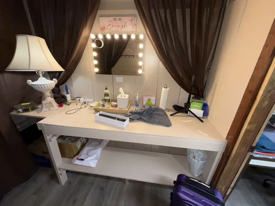 Vanity station with illuminated mirror