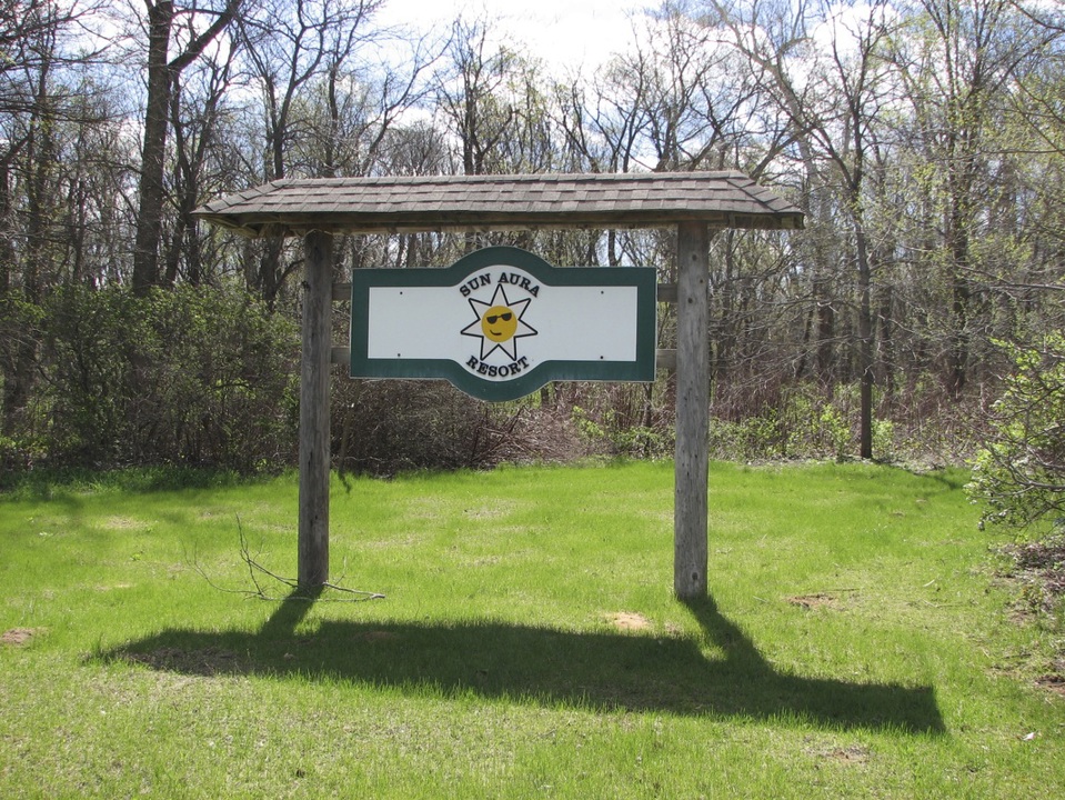 Sun Aura Resort entrance sign