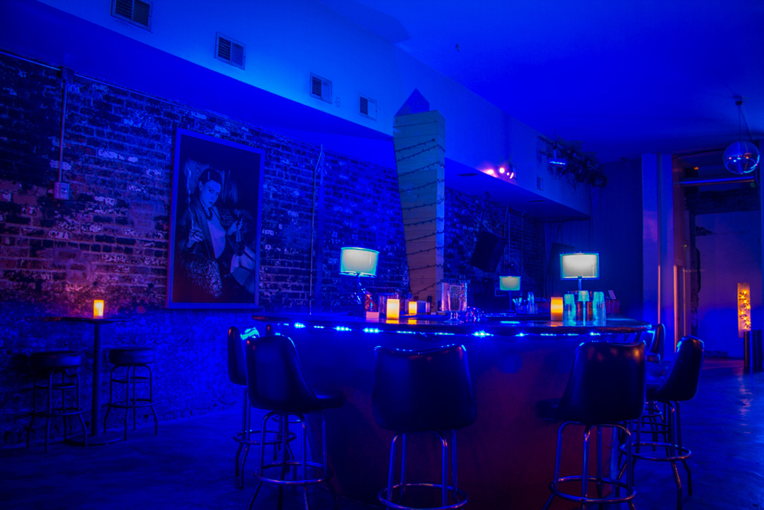 Blue-lit bar and lounge