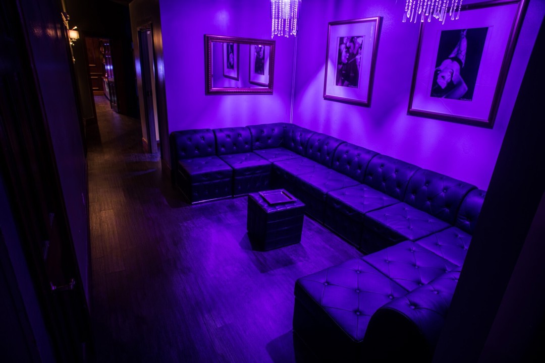 Purple-lit intimate lounge