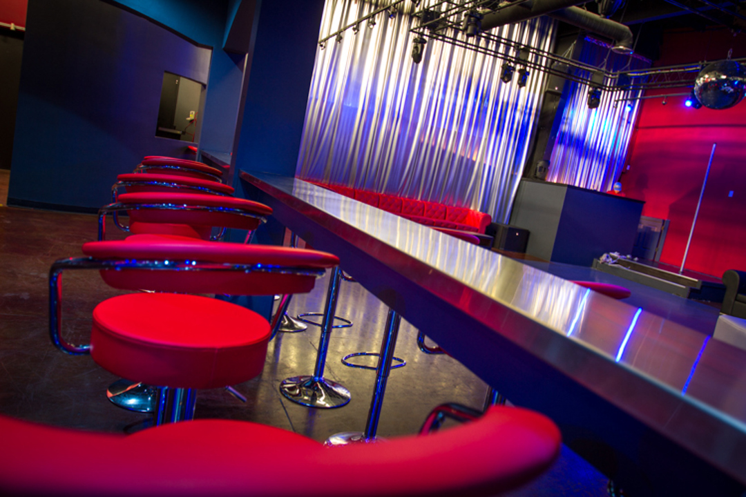 Red seating and mirrored lounge interior