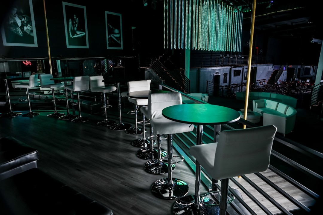 Lounge interior with seating and a green table