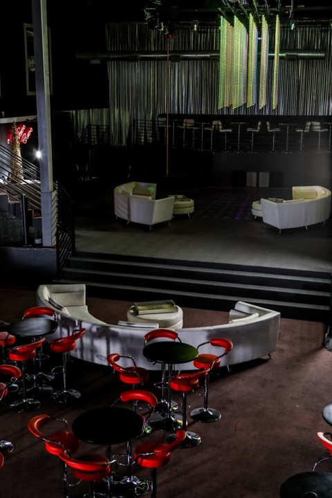 Main lounge with red seating and tables