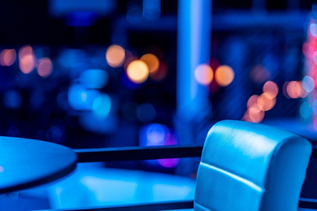 Close-up of blue club seating and tables