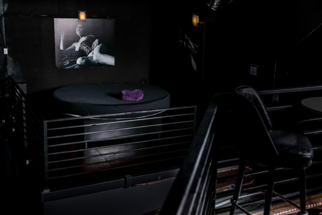 Dark interior staircase and upper-level area