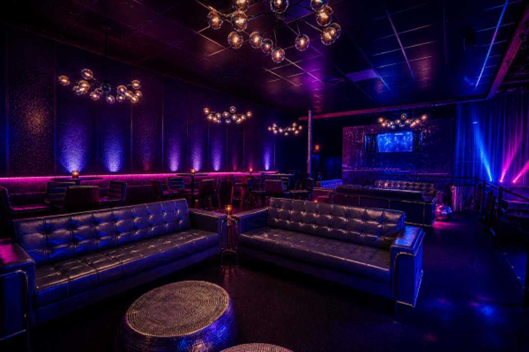 Lounge seating with colorful nightclub lighting