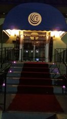 Tabu Social Club entrance with blue awning and red carpet in Catonsville, Maryland