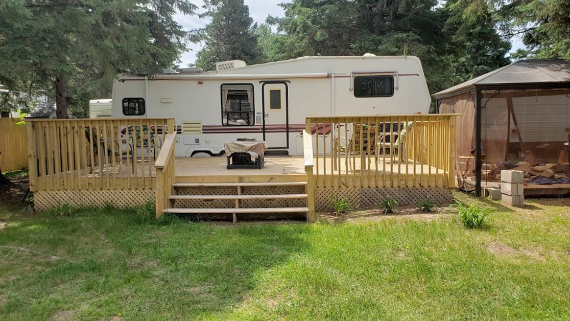 RV campsite and wooden deck