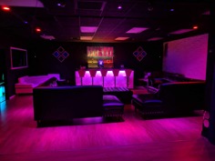PlayhouseLV ultra-lounge interior with neon-lit bar and seating in Las Vegas, Nevada