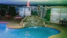 Red Rooster Vegas indoor pool with rock waterfall in Las Vegas, Nevada