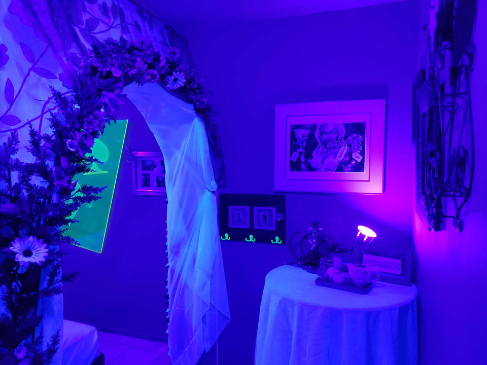 Rabbit Hole themed room with blue and purple lighting