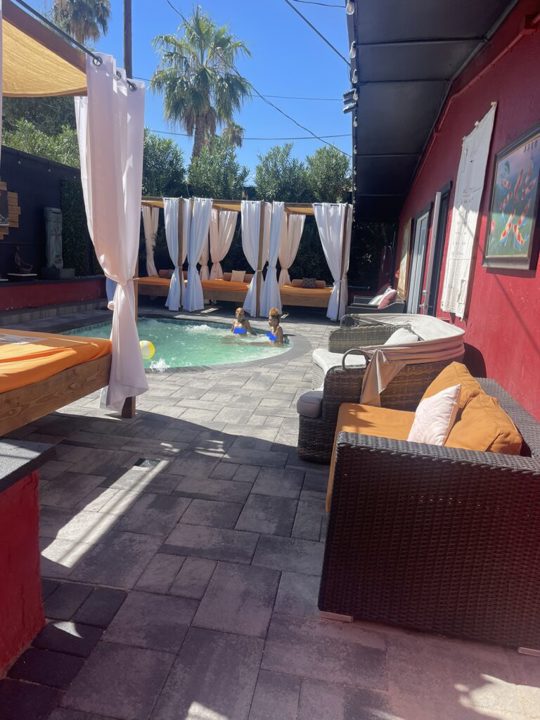 Pool surrounded by private cabanas