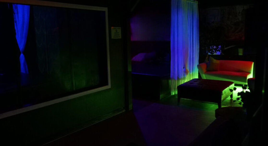 Shadow Box Room interior with blue lighting