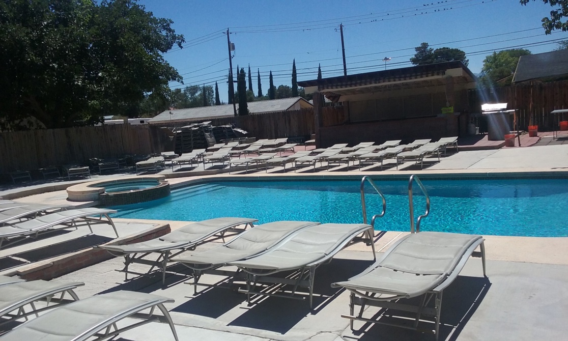 outdoor swimming pool and lounge chairs