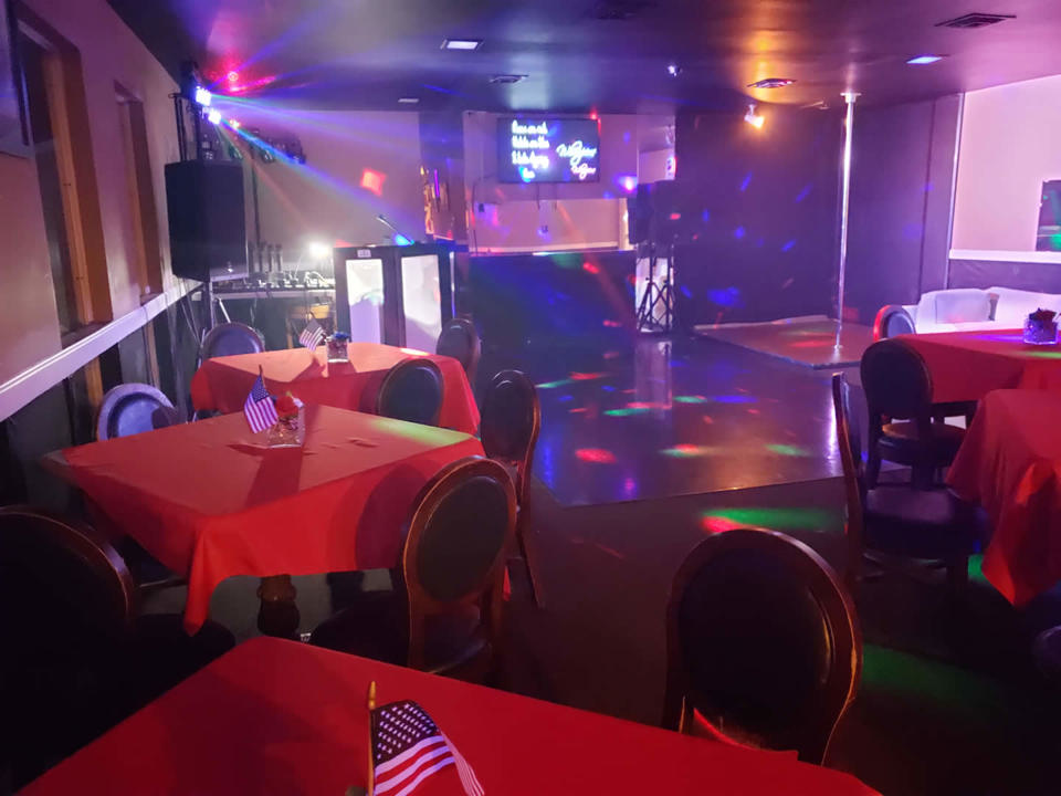 dance floor and DJ area with colorful lighting