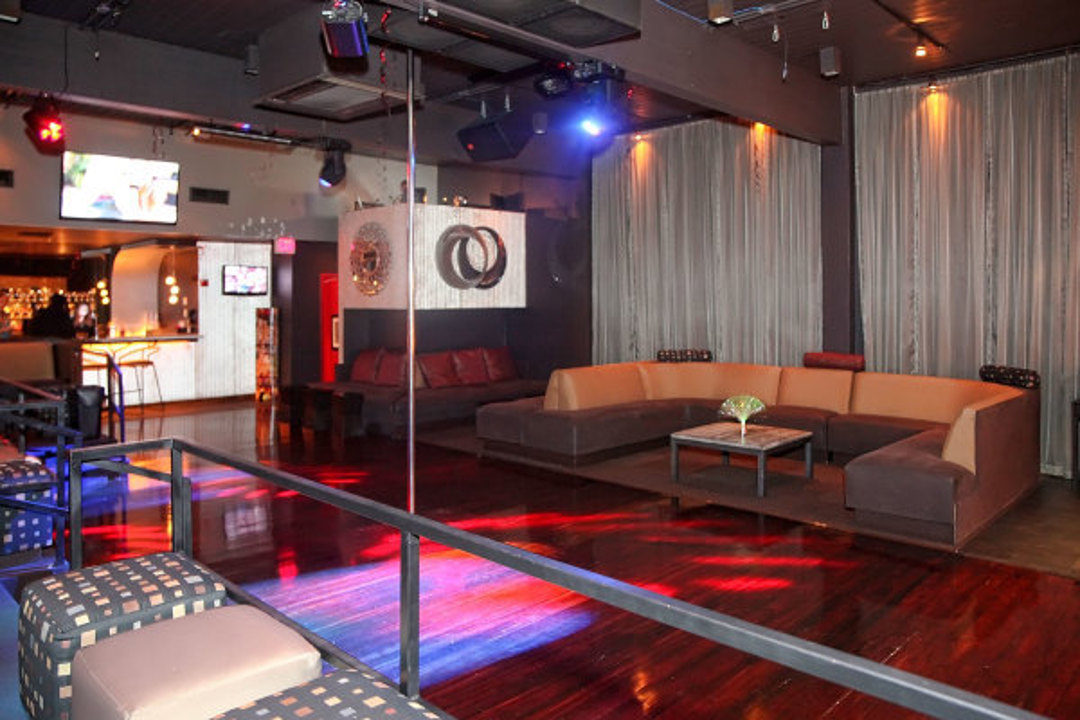 Lounge and dance area with dance pole
