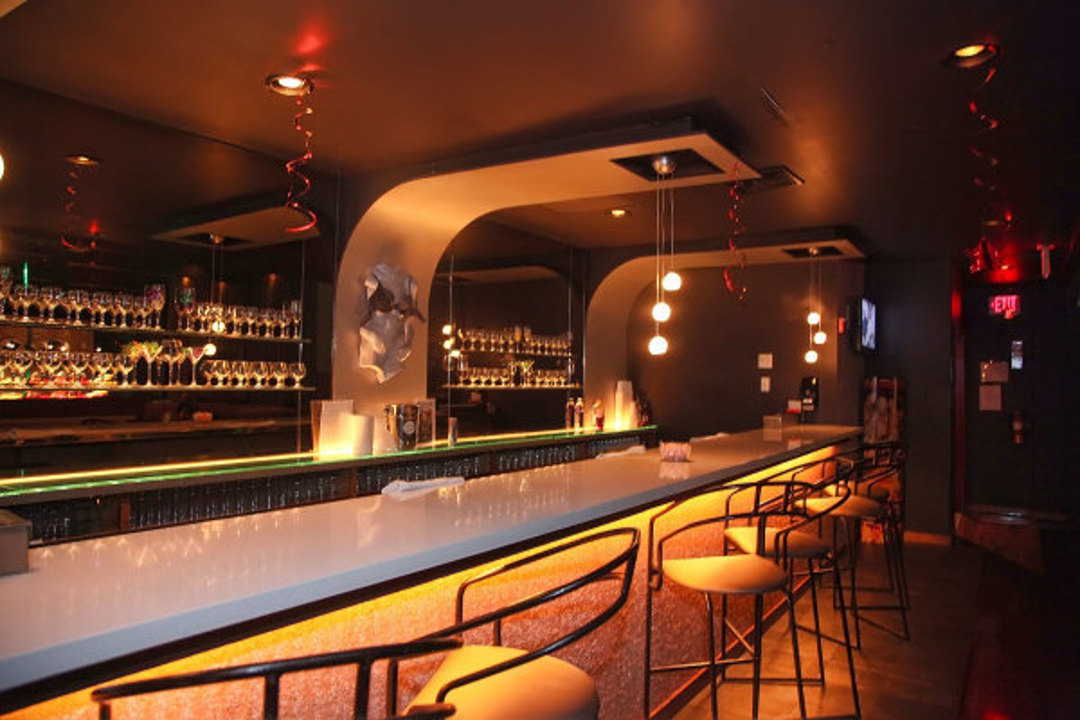 Bar with stools and warm lighting