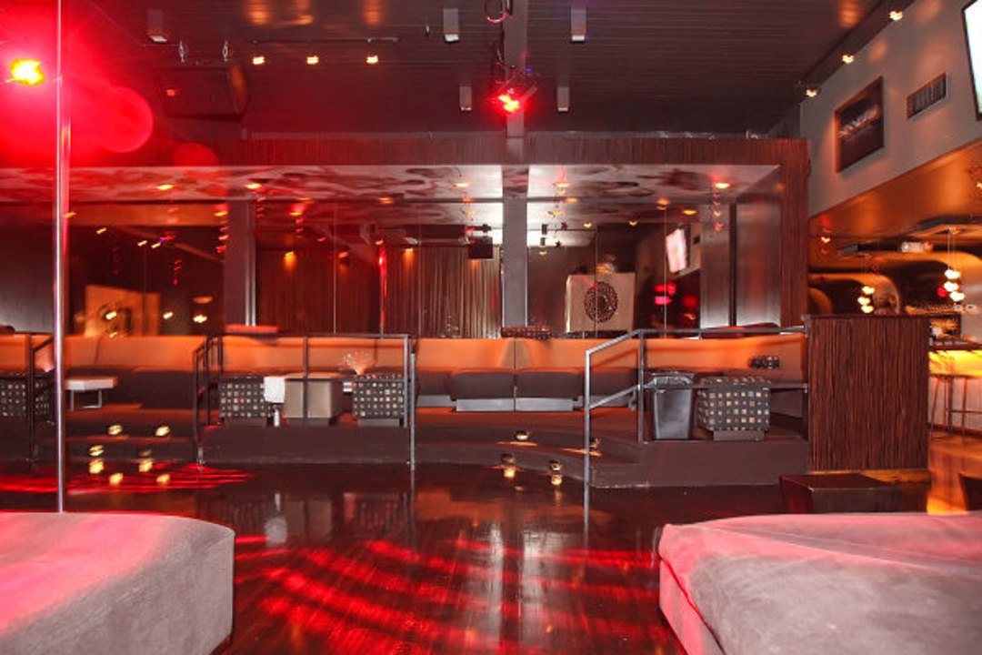 Main lounge with red lighting and seating